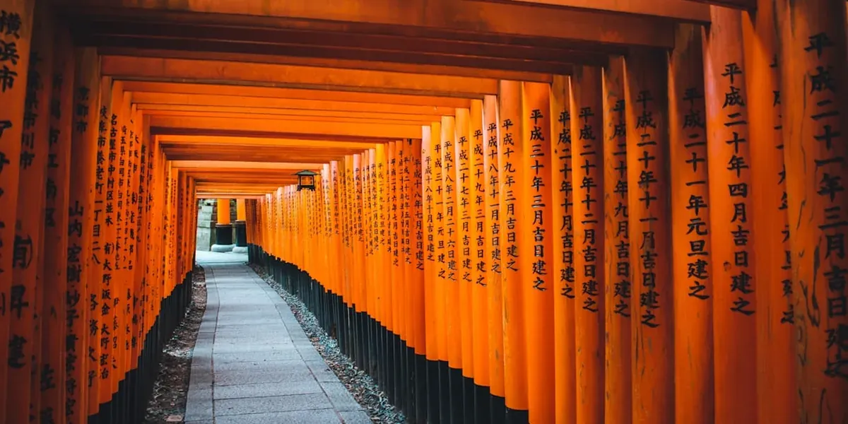 Fushimi Inari torii gates at sunrise with no crowds in Kyoto