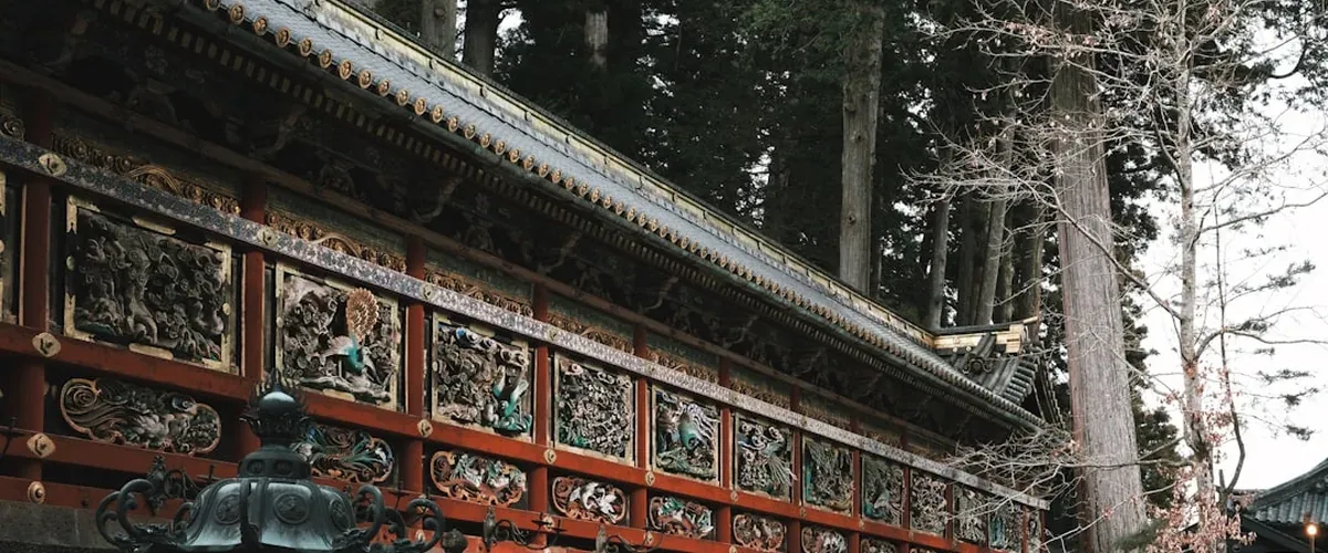 The ornate Toshogu shrine complex in Nikko with its famous carved woodwork and stone lanterns