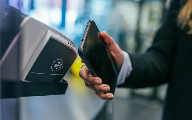 Travel money card and smartphone for budget travel and currency exchange