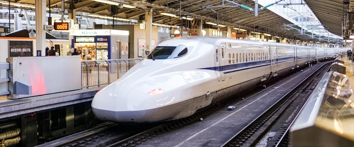 Smartphone showing the Japan Travel by NAVITIME train navigation app with a Tokyo route highlighted
