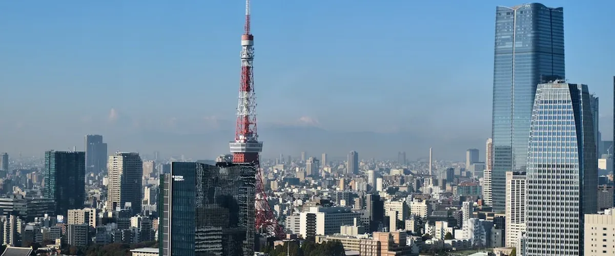 Tokyo city skyline with Mount Fuji visible in the far distance on a clear day