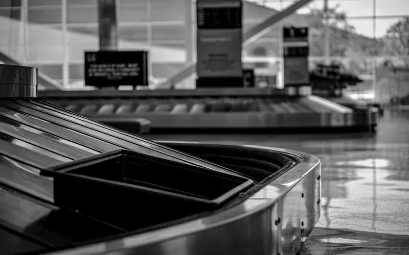 Luggage bags being handled for forwarding delivery service at a Japanese airport or station