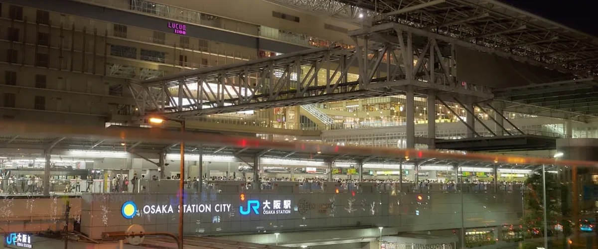 Busy Osaka Umeda station concourse with commuters