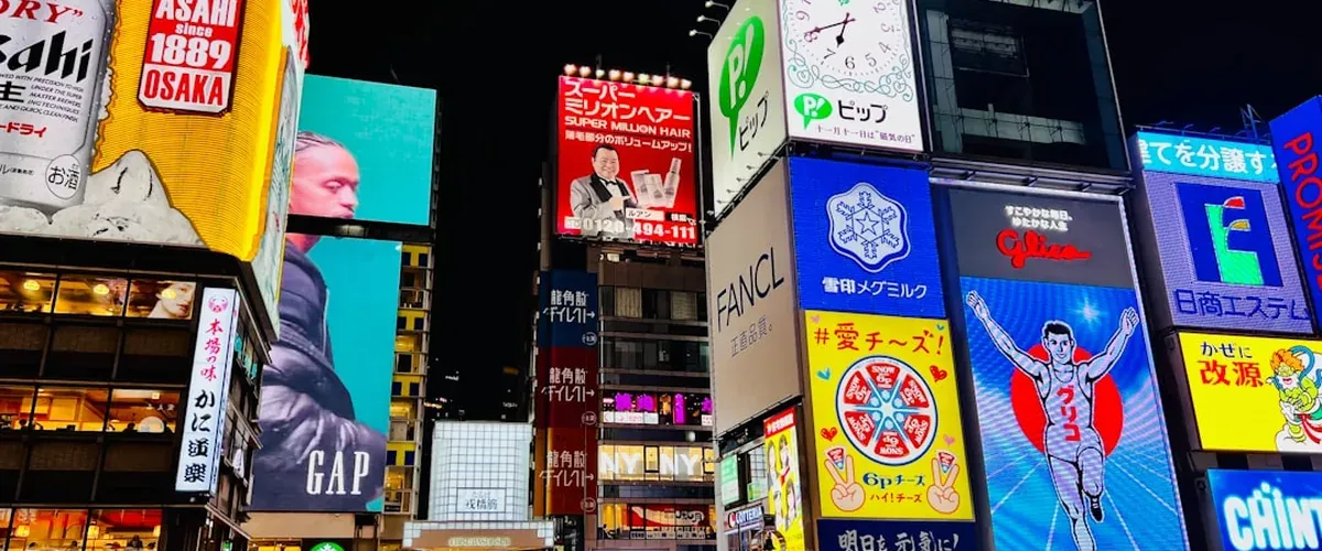 Osaka Namba district at night — budget accommodation hub close to Dotonbori and street food